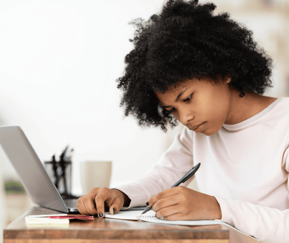 young student learning to write an essay