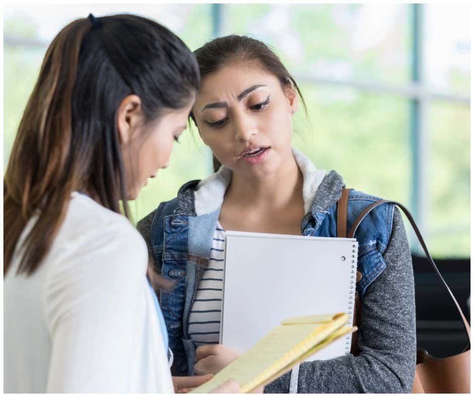 female students asking essential questions to a potential roomie