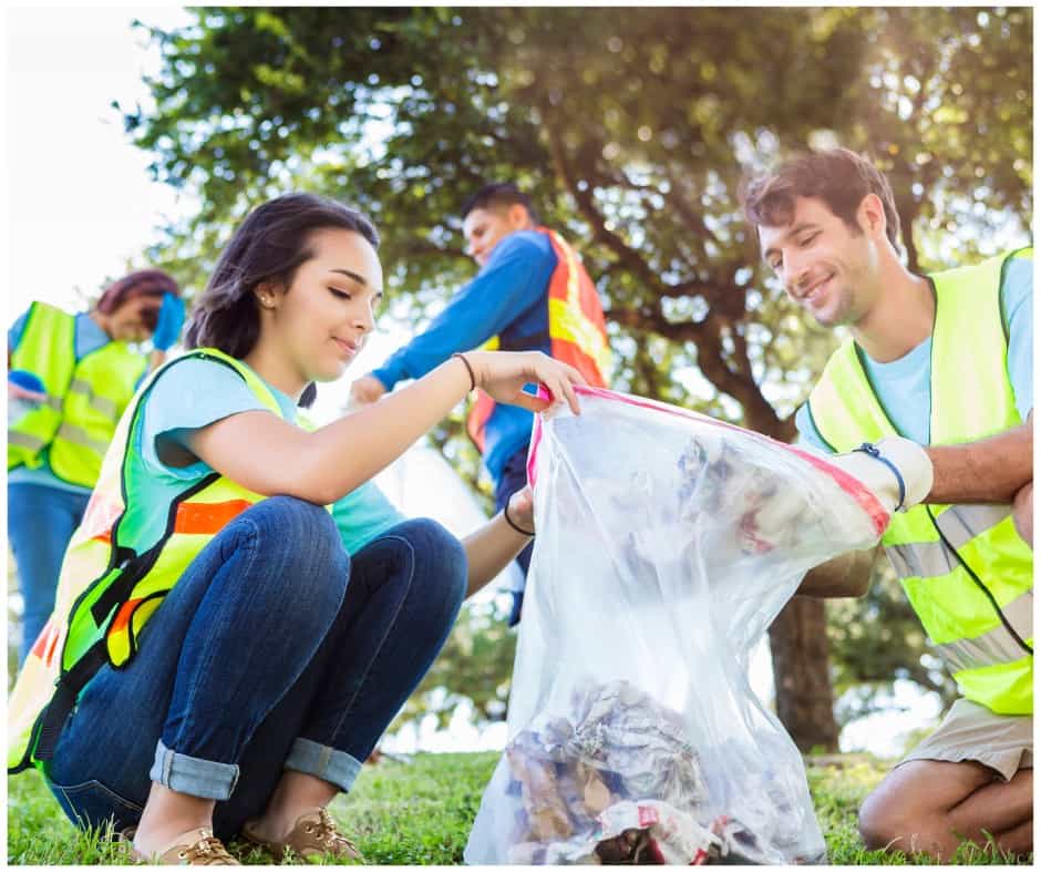 students doing community service cleaning a park