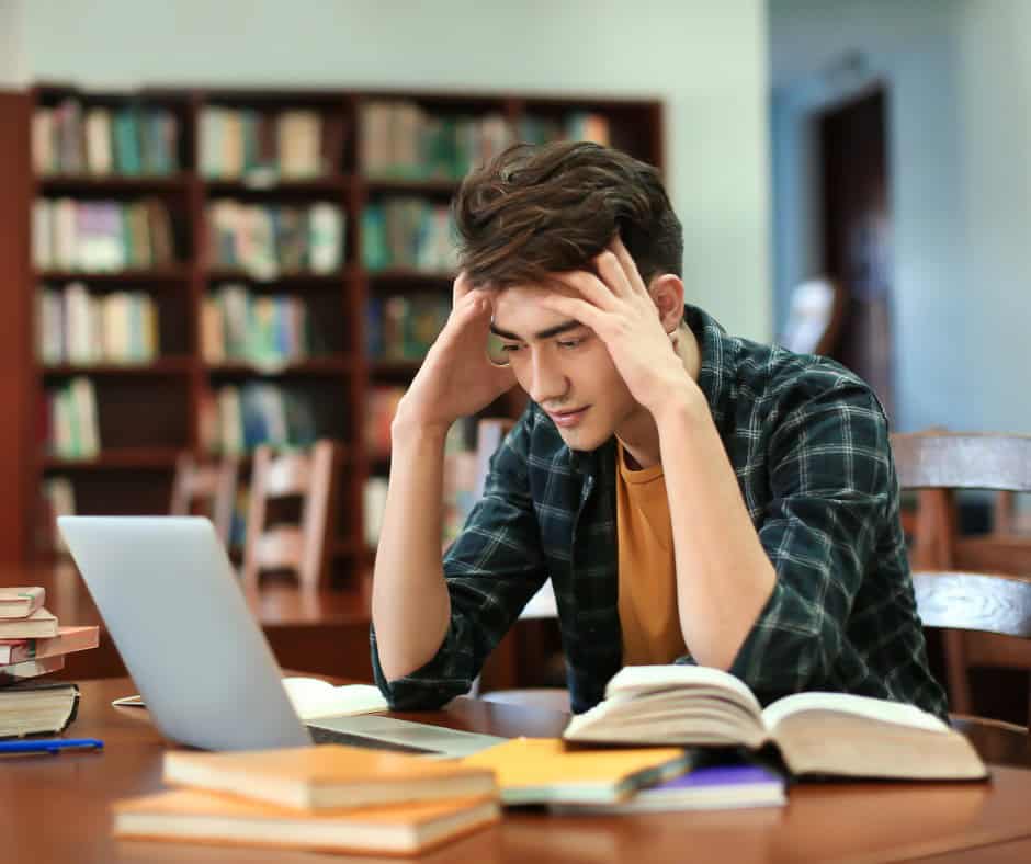 student studying in library