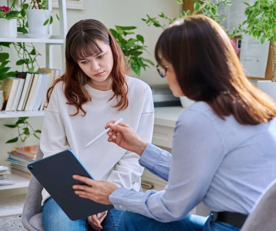 student with school counselor