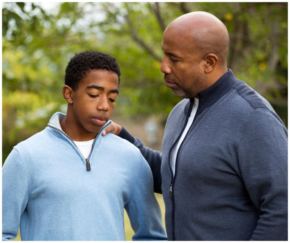 parent comforting teen