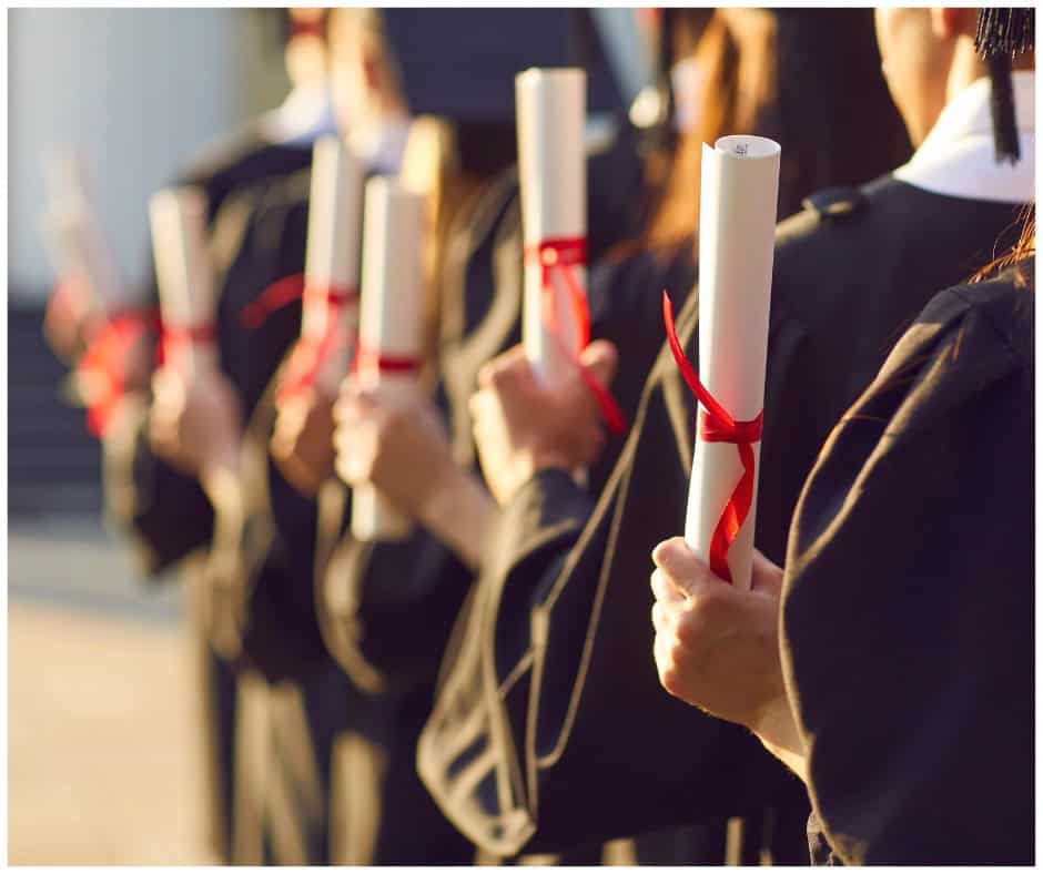 students holding their college degree