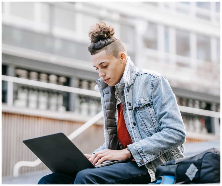 student working on a personal statement on their laptop