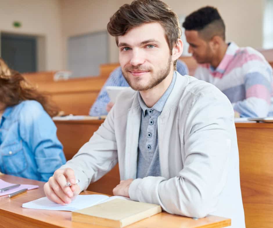 Student attending a college-level dual credit course in a classroom setting