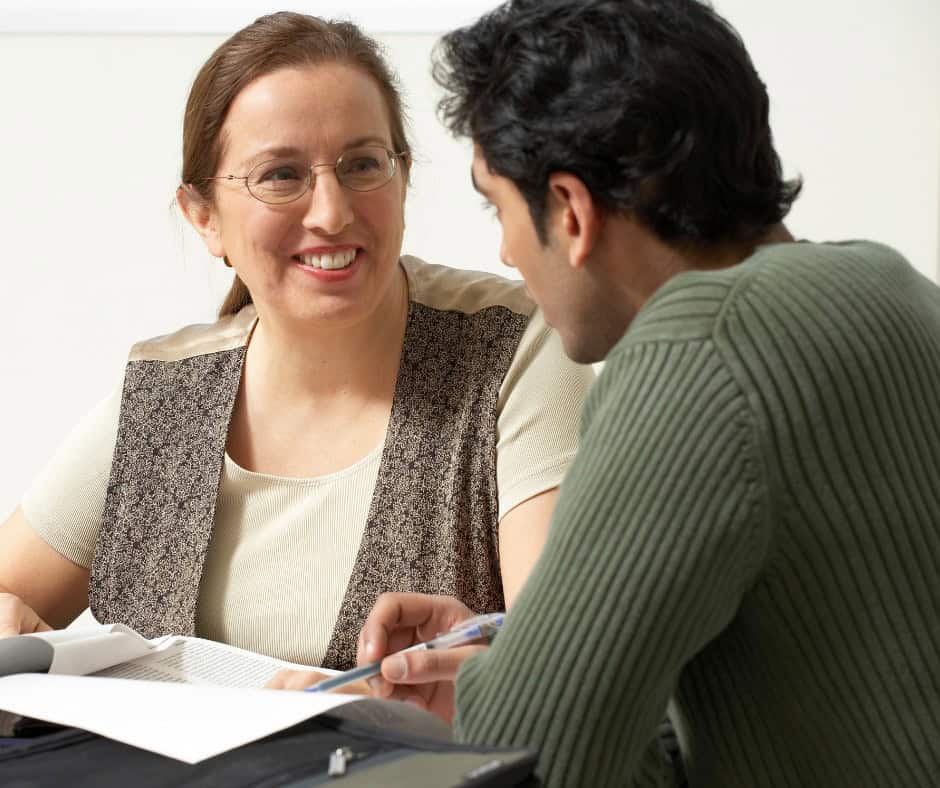 professor helping a college student