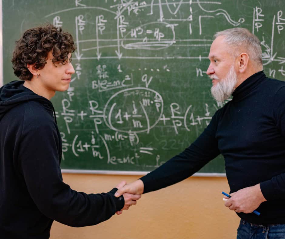 student meeting with a teacher after class